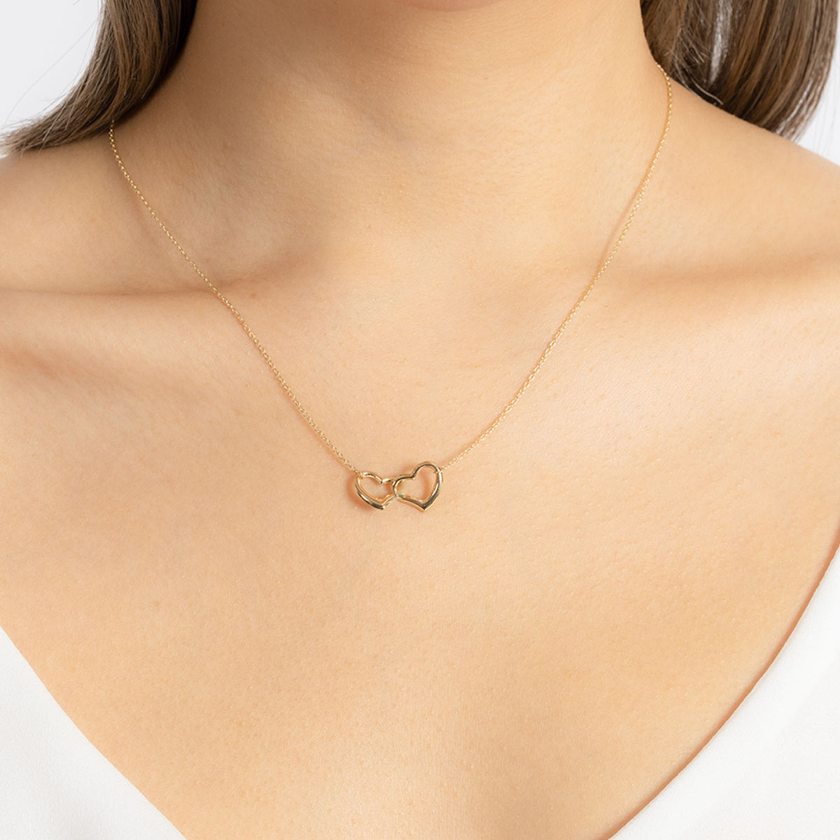 Two hearts intertwined on sale necklace